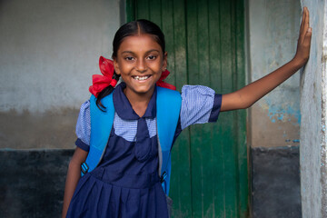Smiling Indian Rural School Girl Standing in school - obrazy, fototapety, plakaty