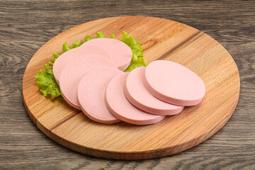 Sliced sausage snak over board