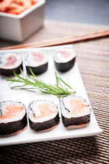 Japanese sushi plate with a bowl of shrimp and wooden chopsticks. Oriental food concept