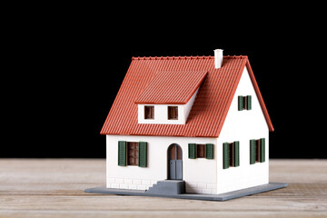House model in front of black background