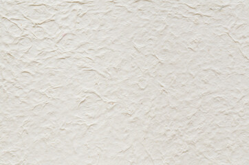 Washi paper with a unique uneven texture. White colored Japanese paper background.