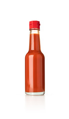 Mexican chili sauce in glass bottle on isolated white background 