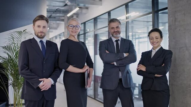 Professional lawyers posing on camera, reliable law firm, trustworthy team