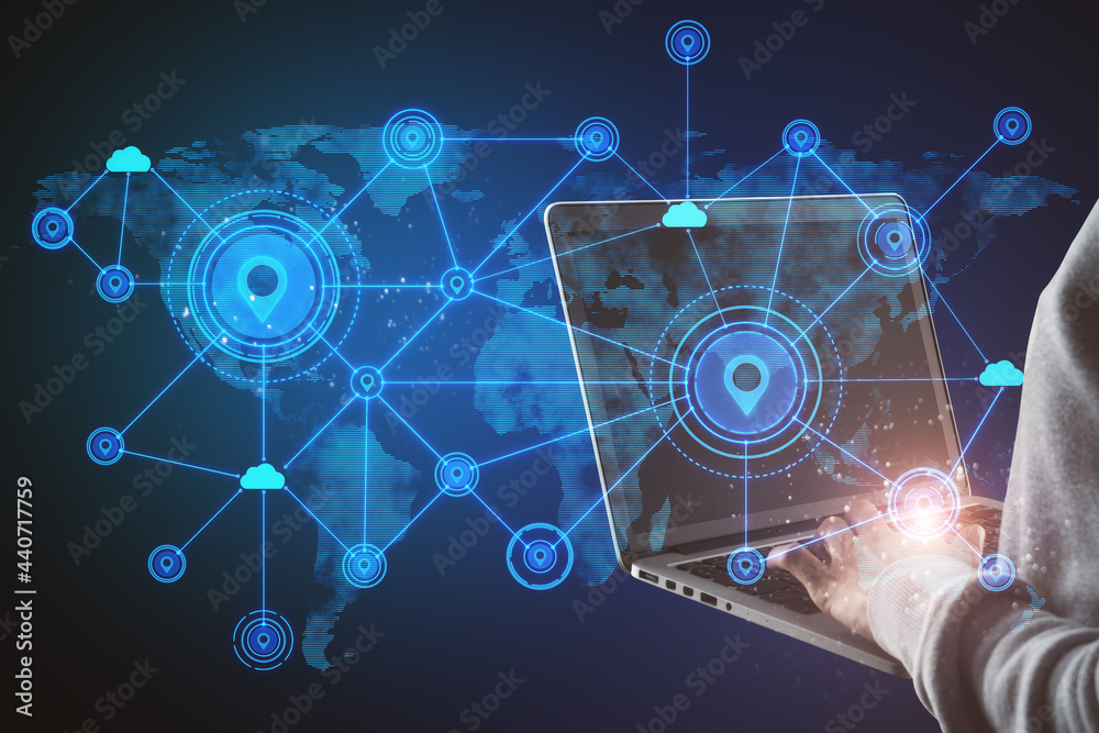 Poster Hand using laptop with abstract map and location pins hologram on blue background. Geolocation and globalization concept.