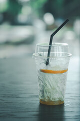 Empty glass with little left iced and sliced orange fruit