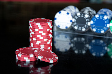 Casino chips on black background isolated
