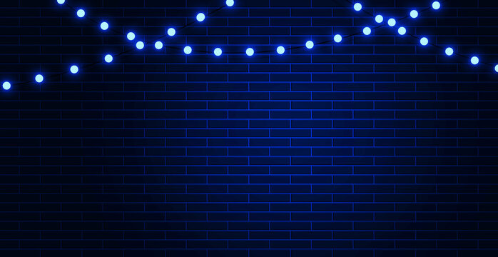 Light neon garland on a dark blue brick wall background