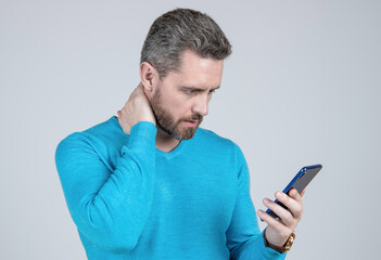 concentrating on reading sms and instant messaging. sad man chat online. agile business blogging.