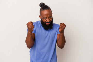 African american man with beard isolated on pink background upset screaming with tense hands.