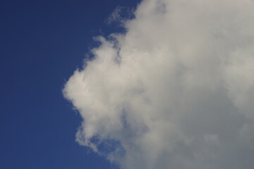 Naklejka na ściany i meble Blue sky with white grey clouds in summer sunny day.