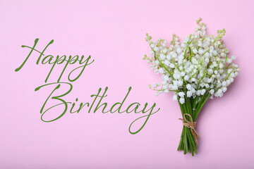 Happy Birthday! Beautiful lily of the valley flowers on pink background, top view