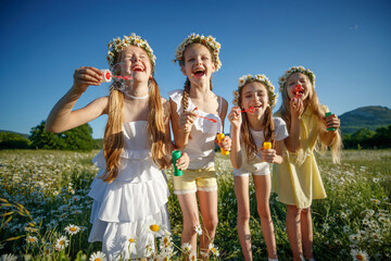 Fototapeta premium Children in nature. The girls play fun. High quality photo