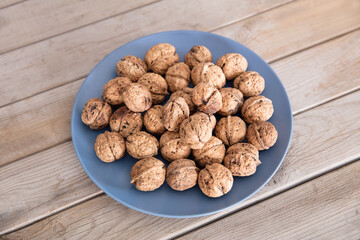 Quality walnuts in a blue plate