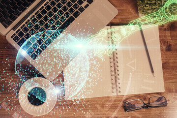 Multi exposure of data theme drawing hologram over topview work desk background with computer. Concept of technology.