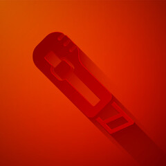 Paper cut Stationery knife icon isolated on red background. Office paper cutter. Paper art style. Vector