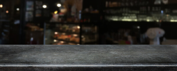 Empty black marble stone table top and blurred coffee shop, cafe and restaurant interior background - can used for display or montage your products. - 440728761
