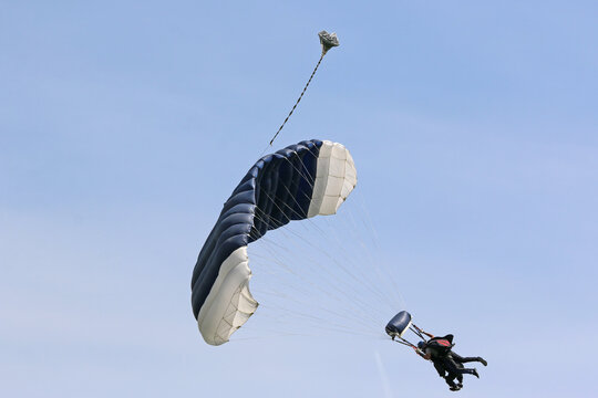 Tandem Skydiver in a blue sky	