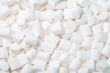 Fototapeta na wymiar Delicious white puffy marshmallows as background, top view