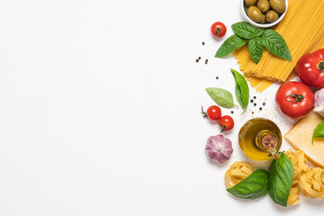 Italian cuisine white background with copy space. Traditional Mediterranean food. Vegetables, pasta, spices and herbs. Menu or recipe concept