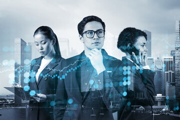 Group of business colleagues working on new venture capital and hi-tech start up and try to forecast risks and estimate prospective earning growth. Hologram chart on Singapore background.