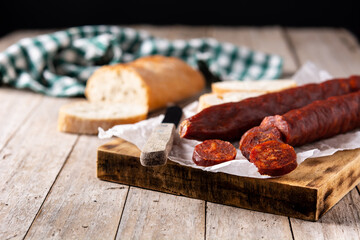 Spanish chorizo sausage on rustic wooden table