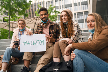 Reunion of friends outdoors in city, life after covid-19 vaccination and back to normal concept.