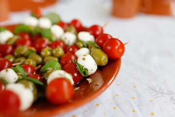 Tomato salad with mozarella, basil and olives