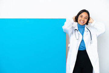 Young mixed race doctor woman with a big placard isolated on white background laughing