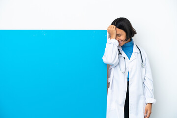 Young mixed race doctor woman with a big placard isolated on white background has realized something and intending the solution