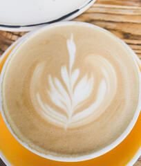 A cup of cappuccino with foam