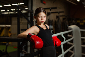 beautiful young woman at boxing training in the gym