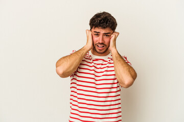 Fototapeta premium Young caucasian man isolated on white background crying, unhappy with something, agony and confusion concept.