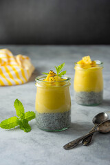 Chia mango pudding in glass jar. Healthy desssert treat. Clean eating