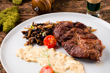 Grilled marbled beef steaks with mashed potatoes, studio shot