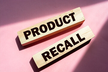 Product Recall written on a wooden blocks on red. Business concept. Warranty and quality control.