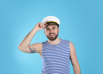 Portrait of sailor on light blue background