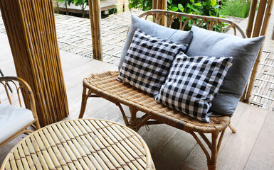 Wooden sofa with bamboo round table.
