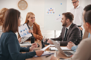Businesspeople having meeting in office. Management consulting