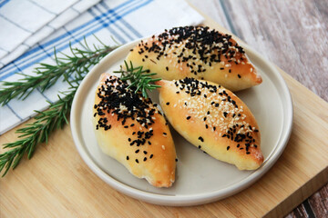 traditional eastern Turkish baked pies with black cumin sprinkle