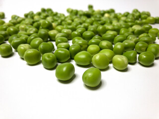 fresh green peas on white background
