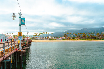 Naklejka premium Palm trees on the shore, photographed from a pier in Santa Barbara, California