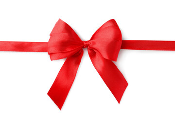 Red bow and ribbon on white background, top view