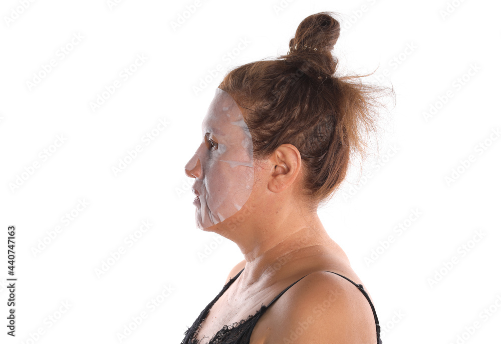 Sticker cosmetic mask on the face of an old woman