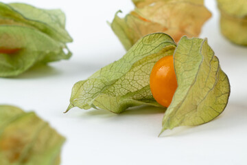 Many pieces of ripe physalis, or golden berry, or ground cherry, isolated on white background.