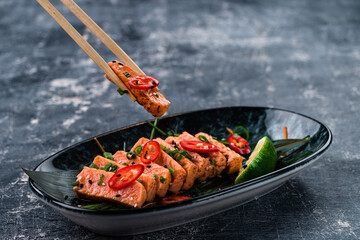 Smoked red fish fillet, trout or salmon steaks served with lemon and micro greens