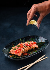 Smoked red fish fillet, trout or salmon steaks served with lemon and micro greens