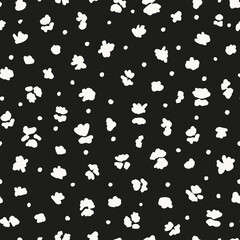 Abstract florals and polka dots seamless repeat pattern. Random placed, vector ditsy daisy botanical minimal print with circles all over surface artwork on black background.