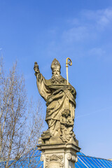 Statue on Charles Bridge (Karluv most, 1357) - famous historic bridge that crosses Vltava River in Prague. Bridge decorated by 30 statues. Prague, Czech Republic.