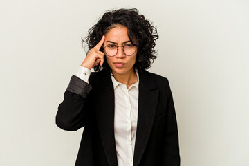 Young latin business woman isolated on white background pointing temple with finger, thinking, focused on a task.