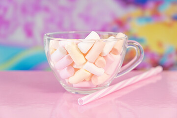 Marshmallows in a mug On a bright pink background